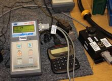 An Atlas Copco controller is being tested and calibrated