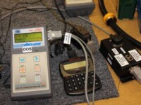 An Atlas Copco controller is being tested and calibrated