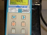 Digital torque wrench display showing readings and control buttons for precise measurement and calibration.